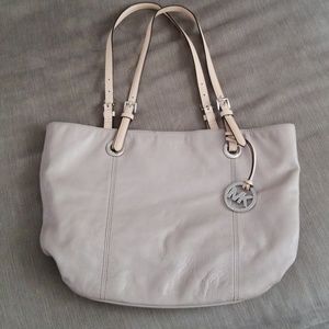 Used Micharl Kors beige purse